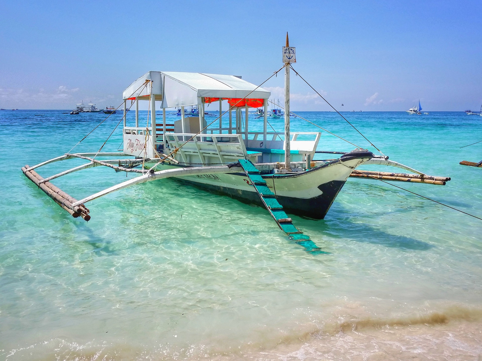 boat moored on beach in the philippines