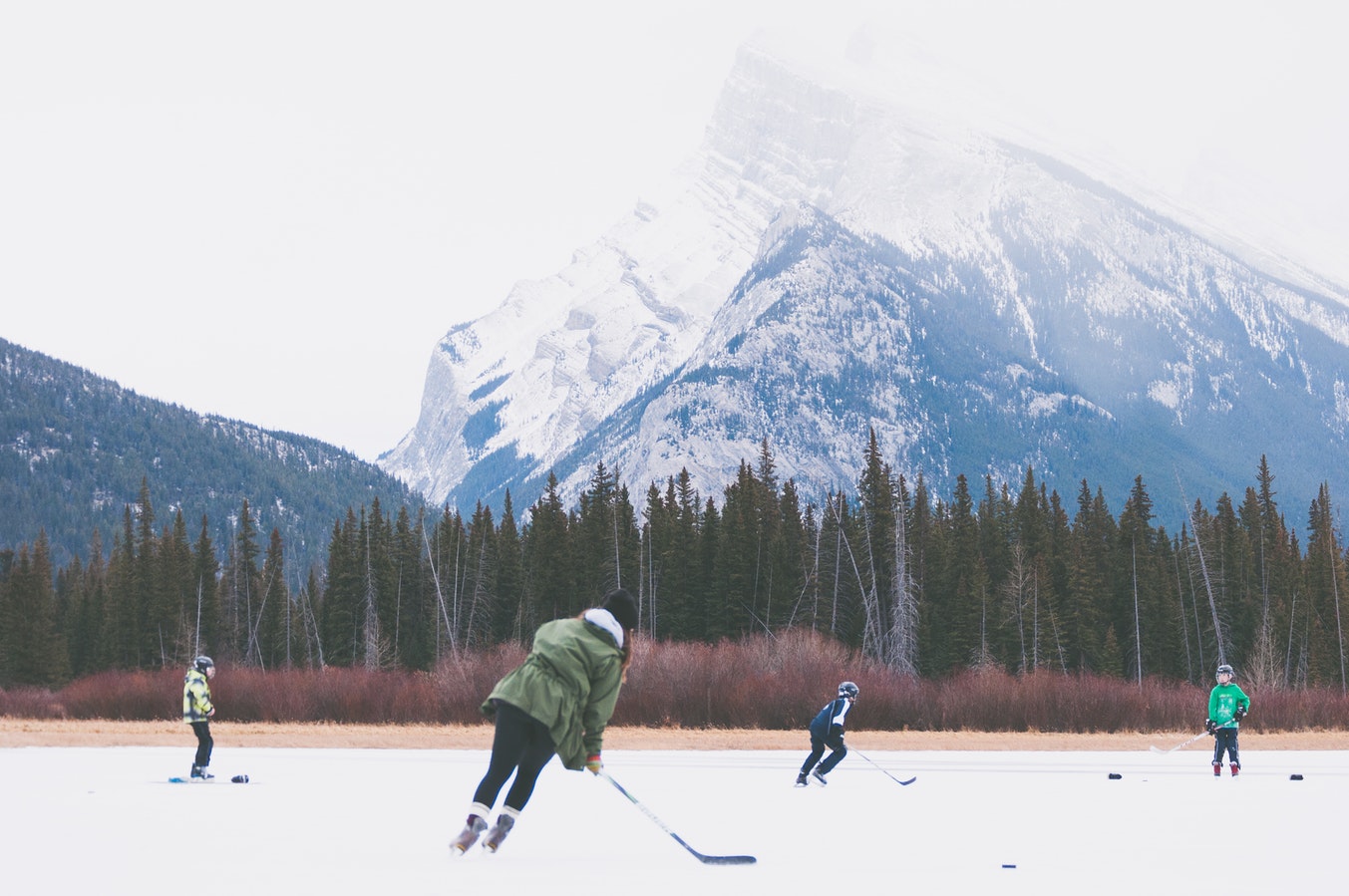 people playing hockey on ice