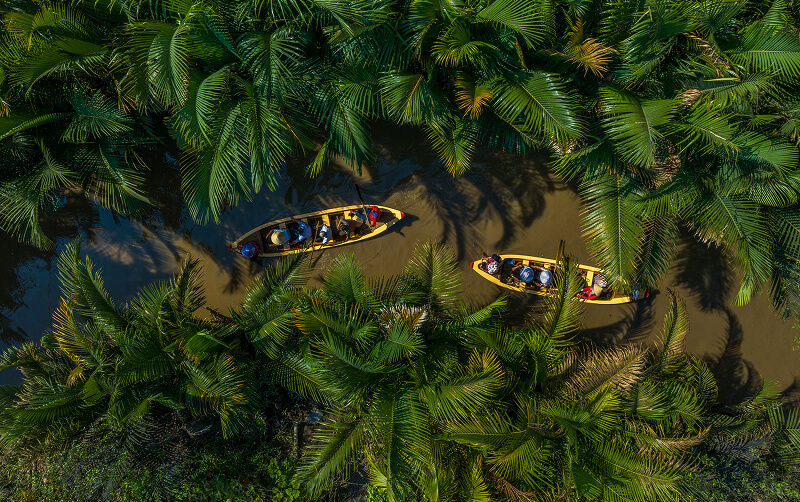people kayaking in river in Cambodia