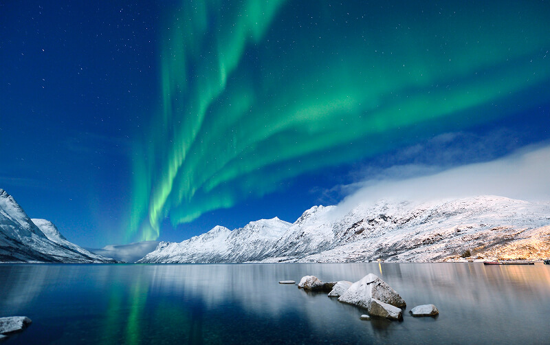 Northern Lights over harbour in Norway