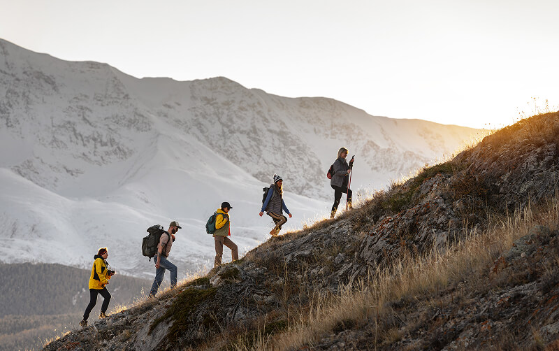 group hiking on snowy mountain