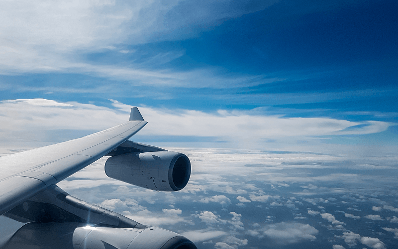 airplane wing view over cloud