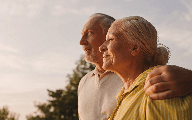 senior couple hugging and smiling